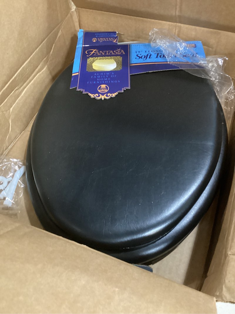 Condition photo showing As Is for soft elongated vinyl toilet seat, black - 19 inch soft vinyl cover with comfort foam cushioning - fits all elongated size fixtures - easy to install fantasia by achim home decor black 19 inch vinyl