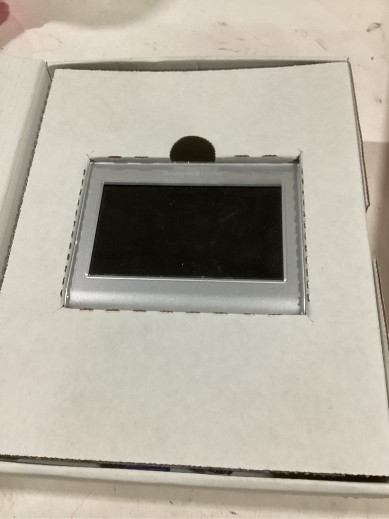 Condition photo showing As Is for Honeywell Home Silver Smart Compatible Thermostat with Wi-Fi Compatibility