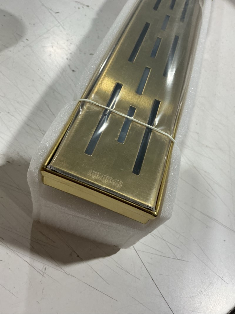 Condition photo showing Good Condition for neodrain 24-in brushed brass rectangular linear shower drain with brick pattern grate, 304 stainless steel bathroom floor drain, gold linear drain with hair strainer,cupc certified golden 24 in
