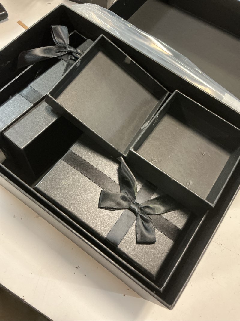 Condition photo showing Good Condition for gift boxes with lids for presents, set of 5 black gift boxes, pre-warpped nesting boxes for gifts, luxury gift box for valentine's day, anniversaries, birthdays,weddings, etc.
