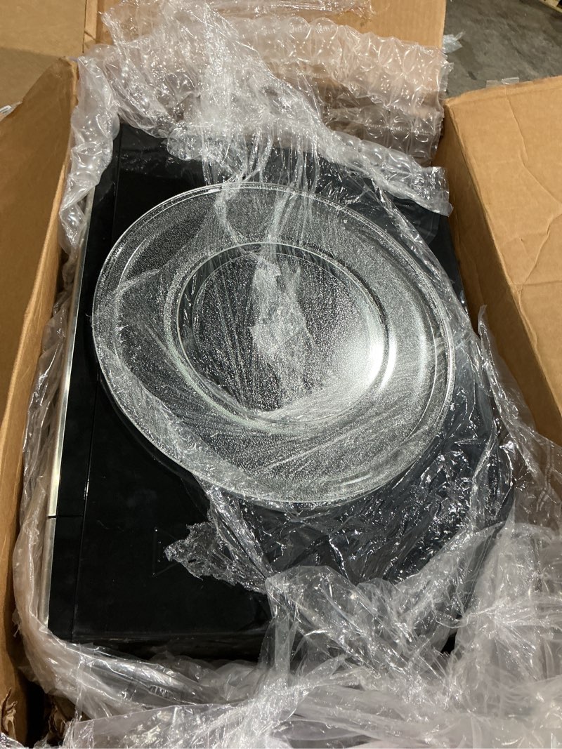 Condition photo showing As Is for ge countertop microwave oven,1, 200-watt capacity, 2.0 cubic ft., 8 auto setting cooking settings, child-lock technology, kitchen essentials for the countertop, dorm room or apartment, stainless steel 2.0 cu.ft. stainless steel