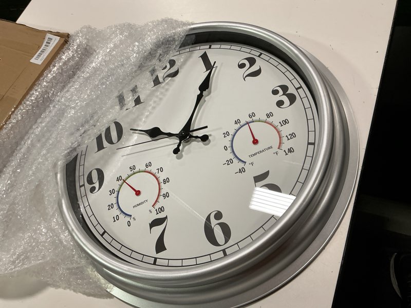 Condition photo showing Good Condition for JENLYSTIME 16 Inch Silver Vintage Waterproof Indoor/Outdoor Wall Clock with Thermometer & Hygrometer, Large Numerals & Silent Sweep Movement - Ideal for Porch, Garden, Pool 16''ht Silver