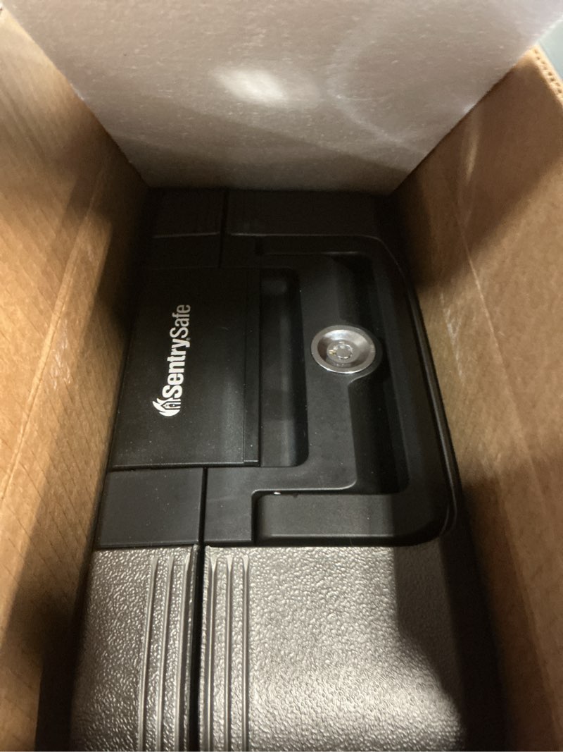 Condition photo showing As Is for sentrysafe dark gray fireproof and waterproof safe with key lock, chest lock box with carrying handle for travel, 0.28 cubic feet, 6.6 x 15.4 x 14.3 inches, cfw20201 1 hr. fireproff, no lid straps