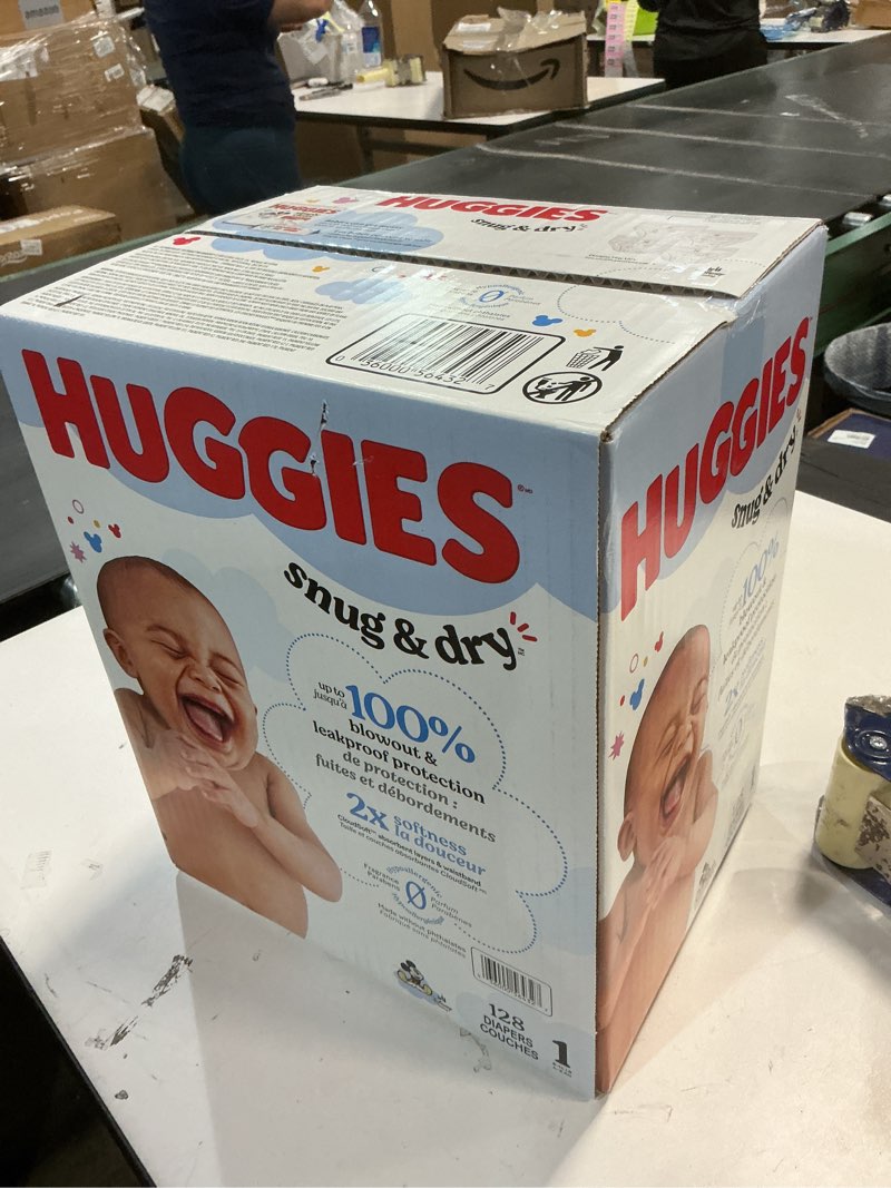 Condition photo showing New/Like New for Huggies Size 1 Diapers, Snug & Dry Newborn Diapers, Size 1 (8-14 lbs), 128 Count, Packaging May Vary Size 1 128