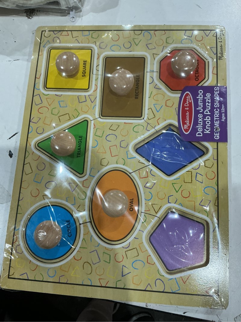 Condition photo showing New/Like New for melissa & doug deluxe jumbo knob wooden puzzle - geometric shapes (8 pcs)