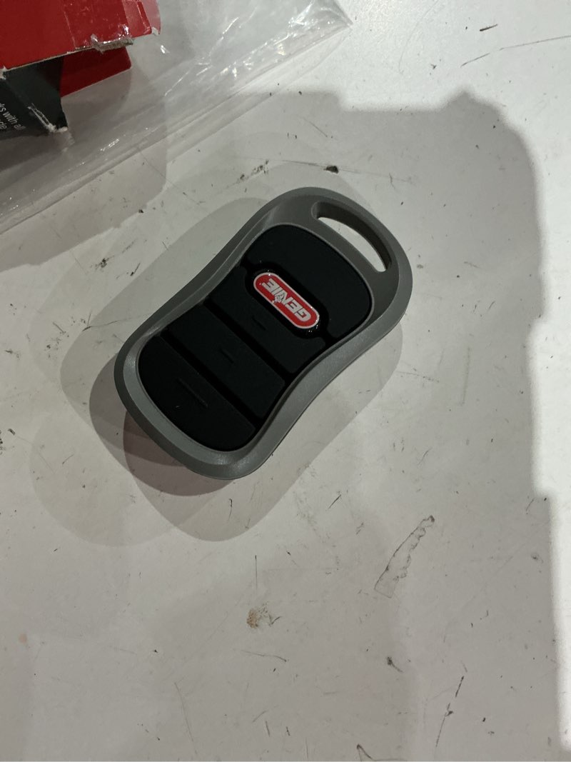 Condition photo showing As Is for genie authentic g3t-r 3-button intellicode garage door opener remote with, works only on genie openers, single pack