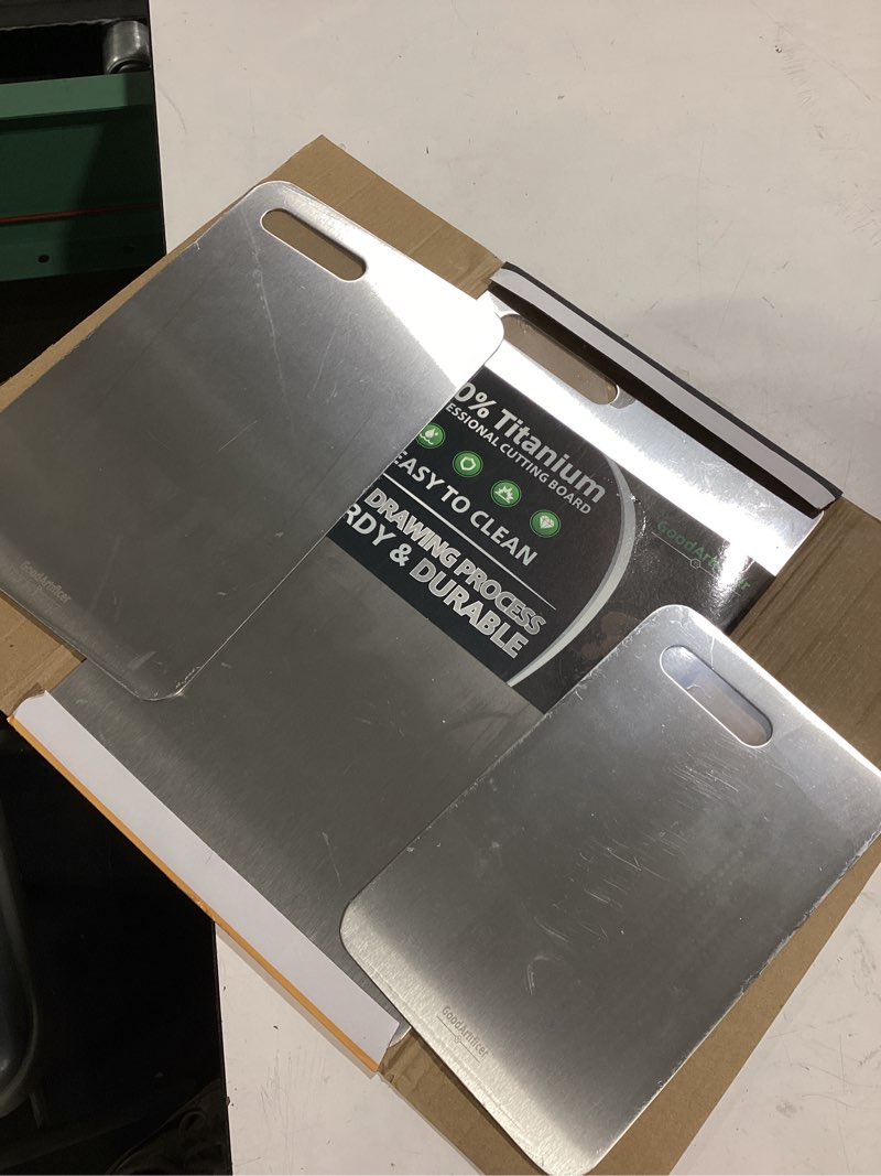 Condition photo showing Good Condition for titanium cutting boards set of 3, 100% pure titanium kitchen cutting board, double-sided non-toxic cutting board, ideal for slicing and dicing meats, features handle, dishwasher safe silver 16"l*10"w(s+m+l)