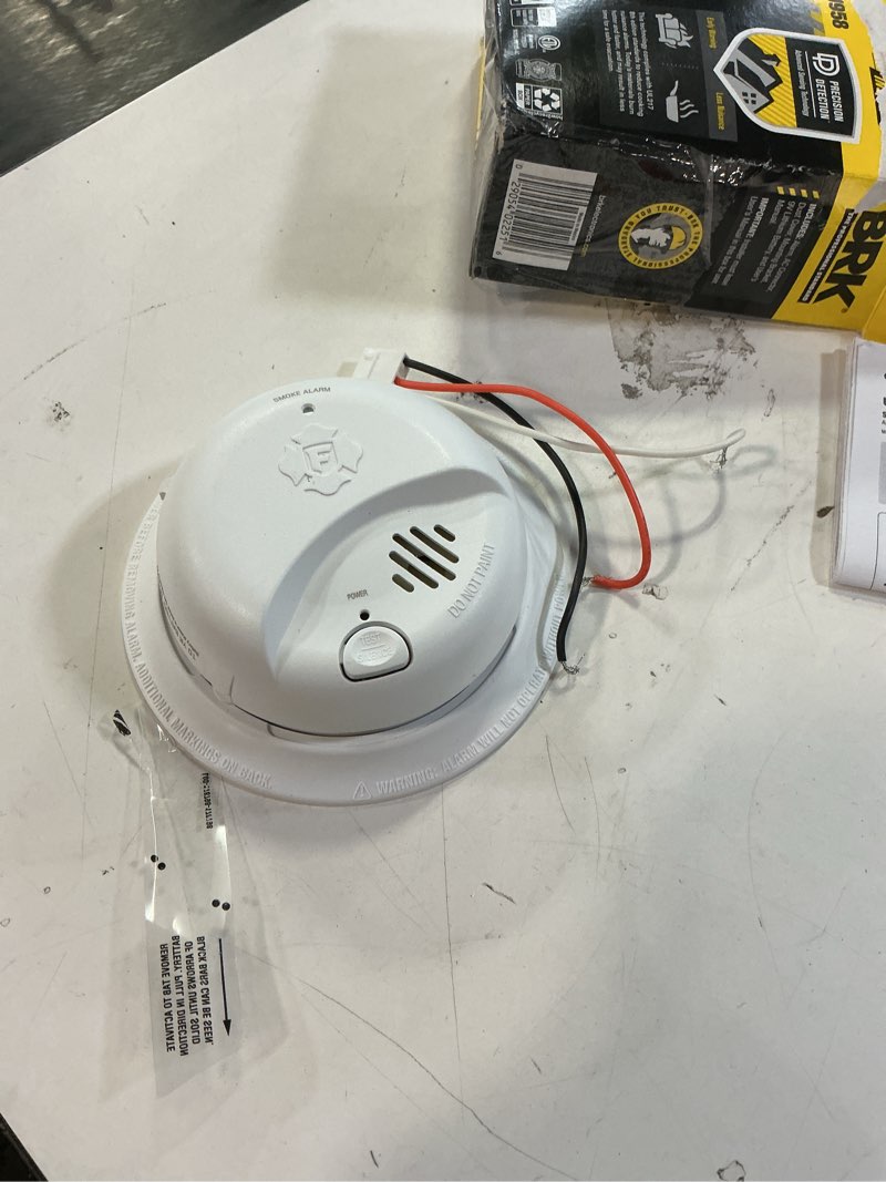 Condition photo showing As Is for first alert brk 10-year battery hardwired (with battery back-up) ionization interconnected smoke detector