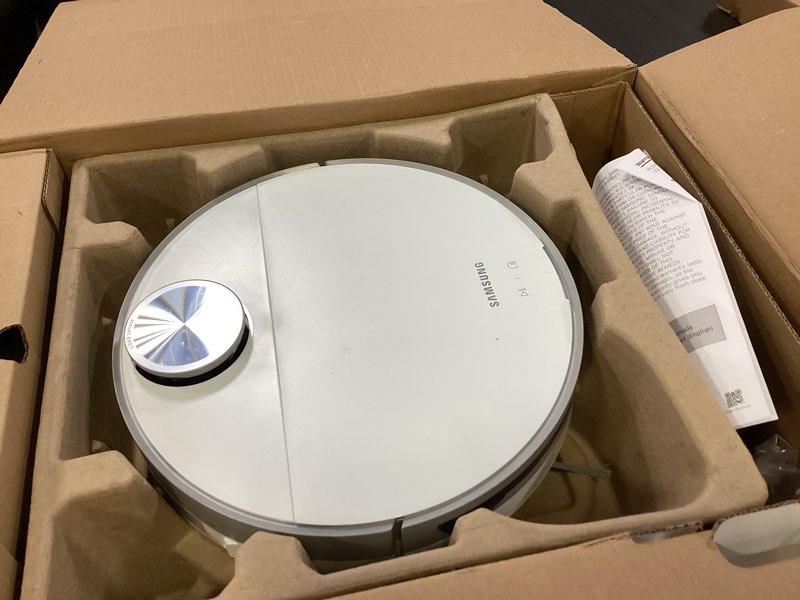 Condition photo showing As Is for SAMSUNG Jet Bot+ Robot Vacuum Cleaner w/ Clean Station, Automatic Emptying, Precision Cleaning, 5-Layer Filter, Intelligent Power Control for Hardwood Floors, Carpets, Area Rugs, VR30T85513W/AA, White Jet Bot +