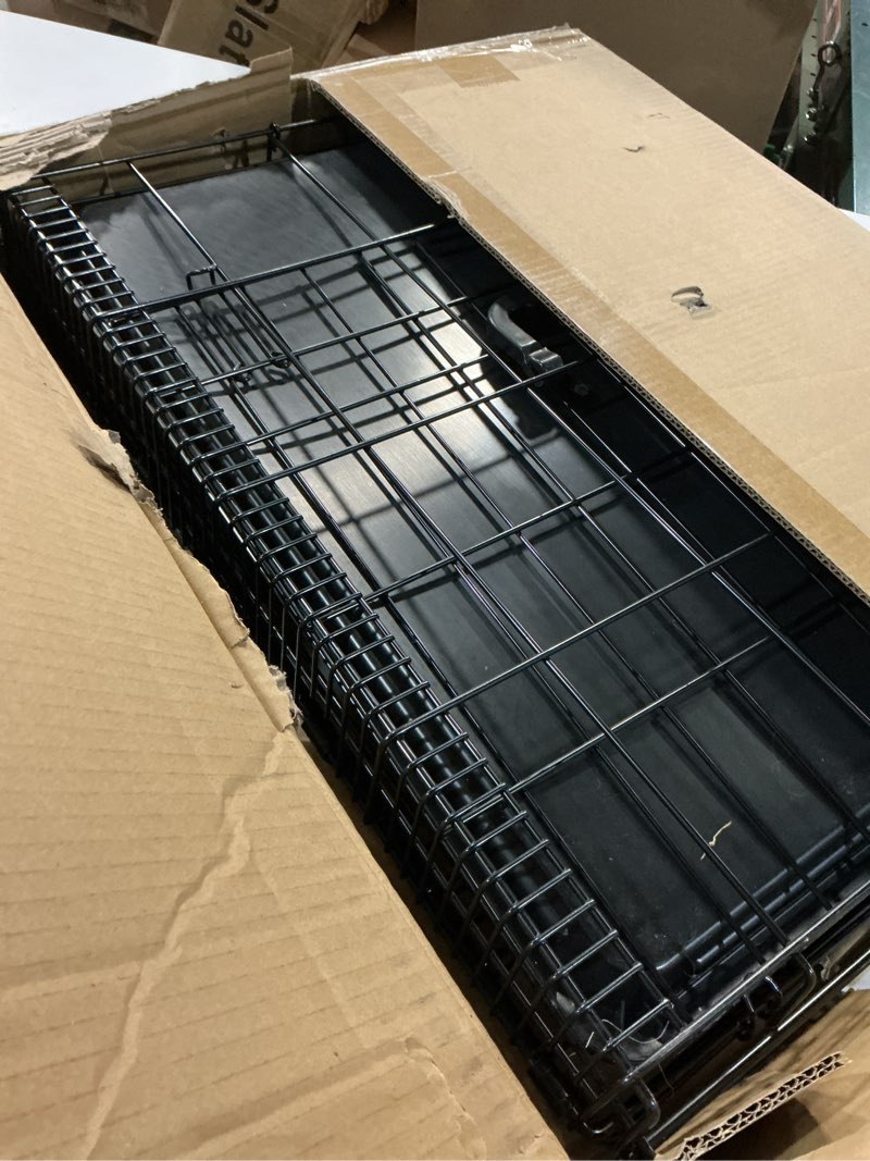Condition photo showing Good Condition for Amazon Basics Durable, Foldable Metal Wire Small Dog Crate with Tray, Single Door, 24 x 18 x 20 in, Black 24 x 18 x 20 in Single Door w/ Divider