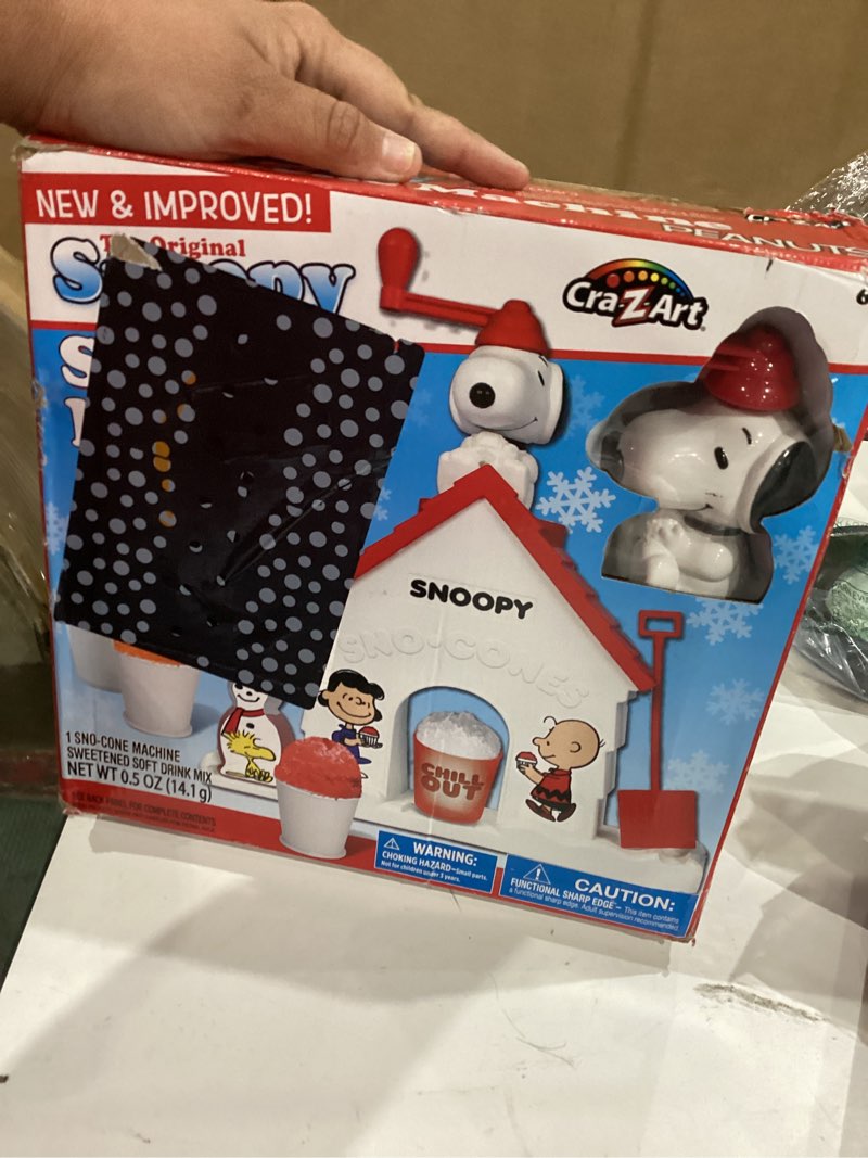 Condition photo showing As Is for cra-z-art snoopy sno-cone machine, snow cone shaved ice maker ice shaver, snoopy house shaped shaved ice maker comes with fruit punch flavor packet, ages 6 and up, white