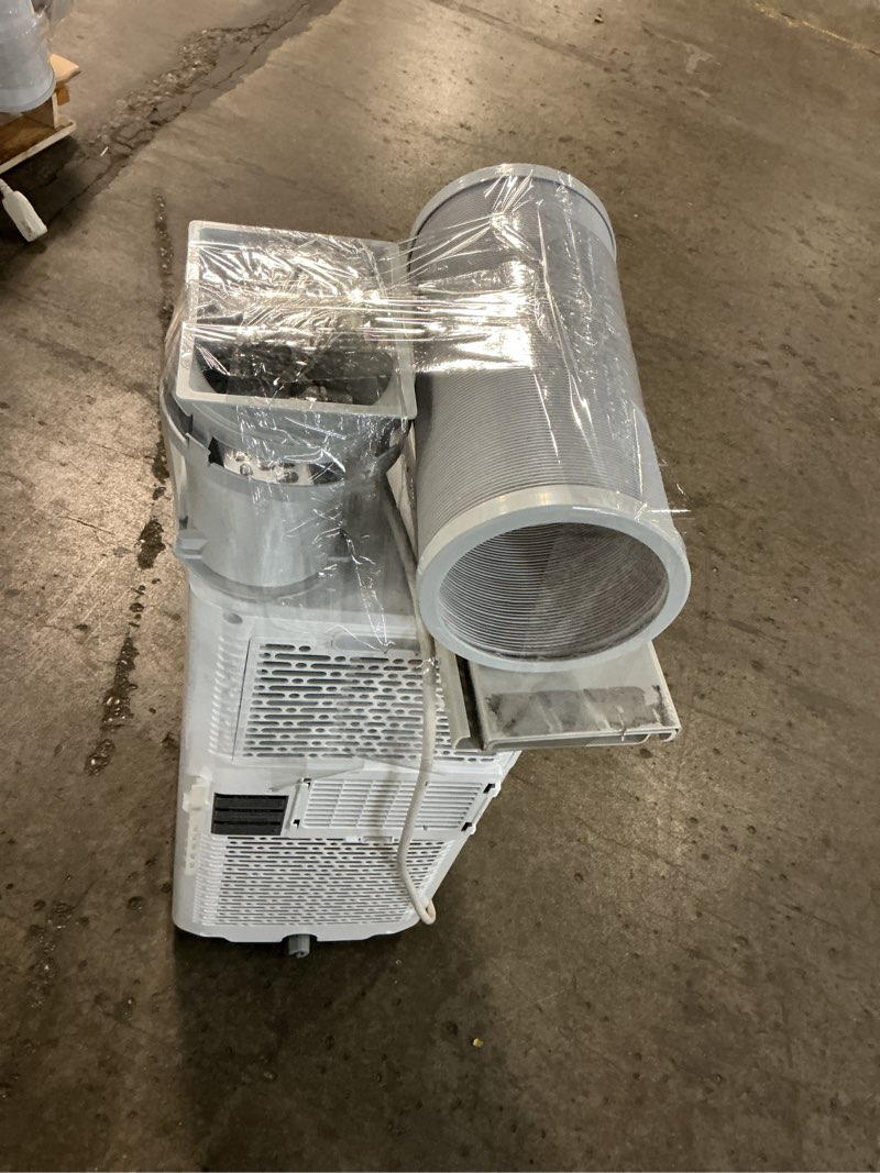 Condition photo showing As Is for 6,000 btu (sacc) / 8,765 btu (ashrae) portable air conditioner cools up to 250 sq. ft.