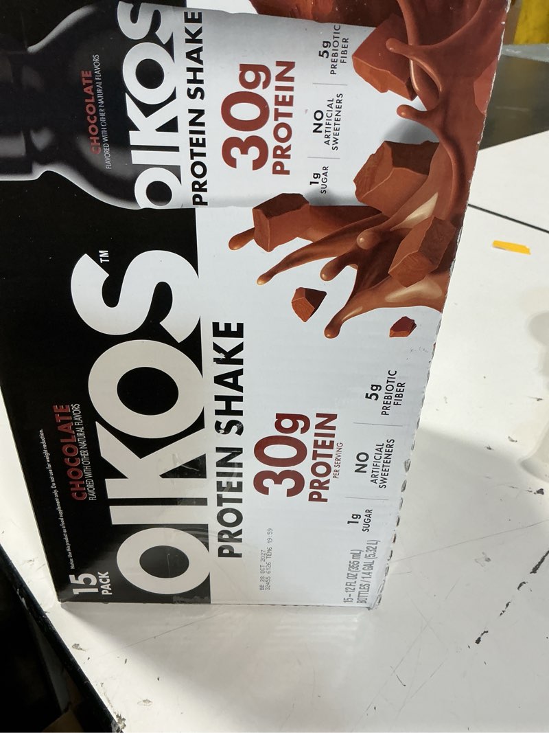 Condition photo showing New/Like New for oikos protein shake chocolate 30g protein shelf stable 12 fl oz bottle 15 count