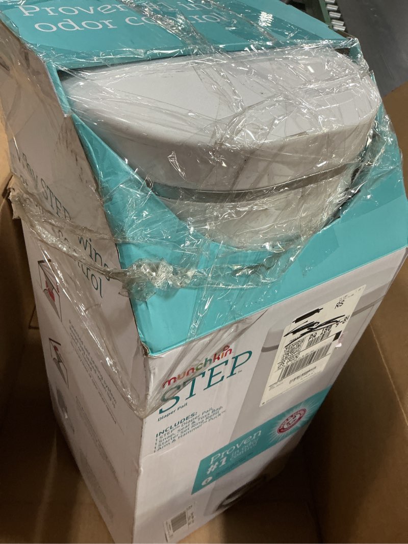 Condition photo showing As Is for munchkin® step™ diaper pail powered by arm & hammer, #1 in odor control, award-winning, includes 1 snap, seal & toss™ bag, 1 starter refill ring, and 1 puck™ baking soda cartridge