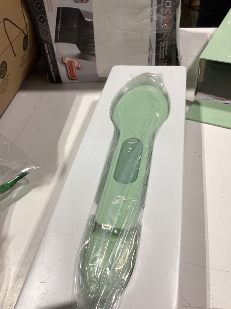 Condition photo showing Good Condition for nori press travel steam iron - handheld iron with optional steam feature - no ironing board required - easy to use w/ 6 fabric settings - removes wrinkles - user manual included - green
