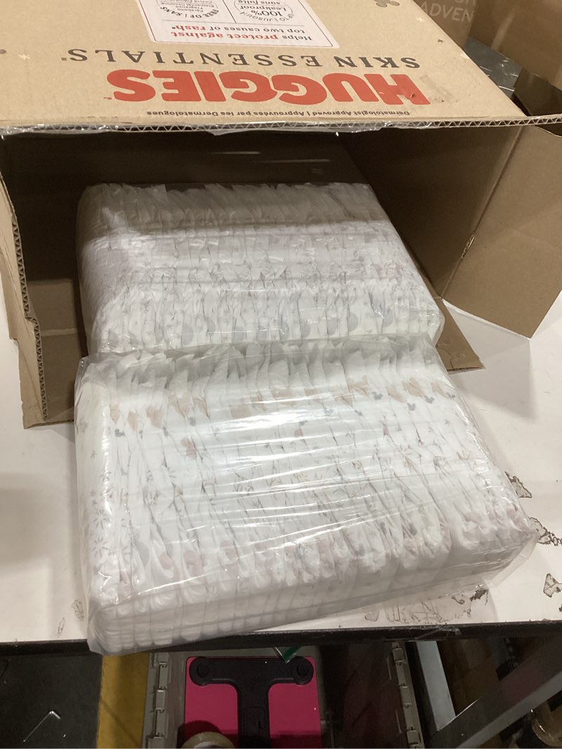 Condition photo showing As Is for Huggies Size 5 Diapers, Skin Essentials Baby Diapers, Size 4 (27+ lbs), 132 Count (2 Packs of 66), Packaging May Vary