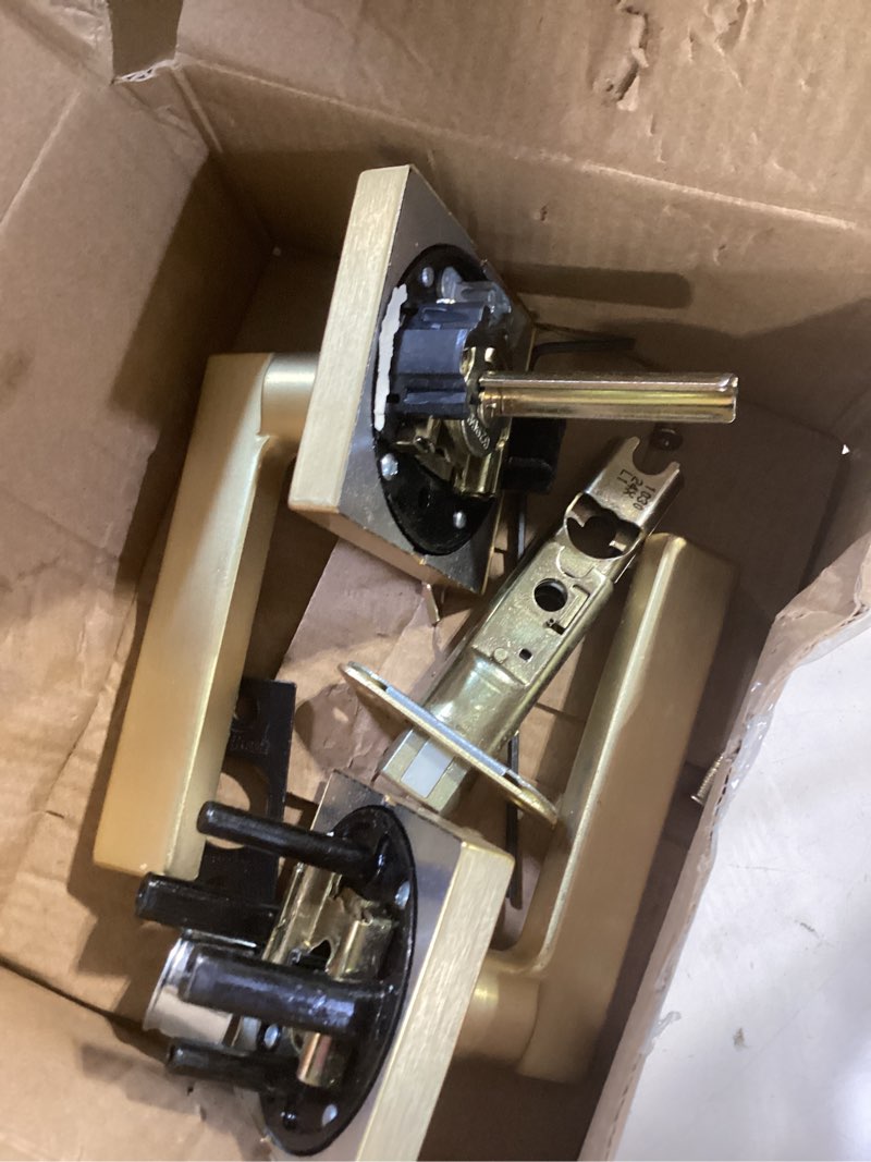 Condition photo showing As Is for kwikset casey interior privacy door handle with lock, door lever for bathroom and bedroom, satin brass reversible keyless push button lock door lever satin brass 1 pack privacy