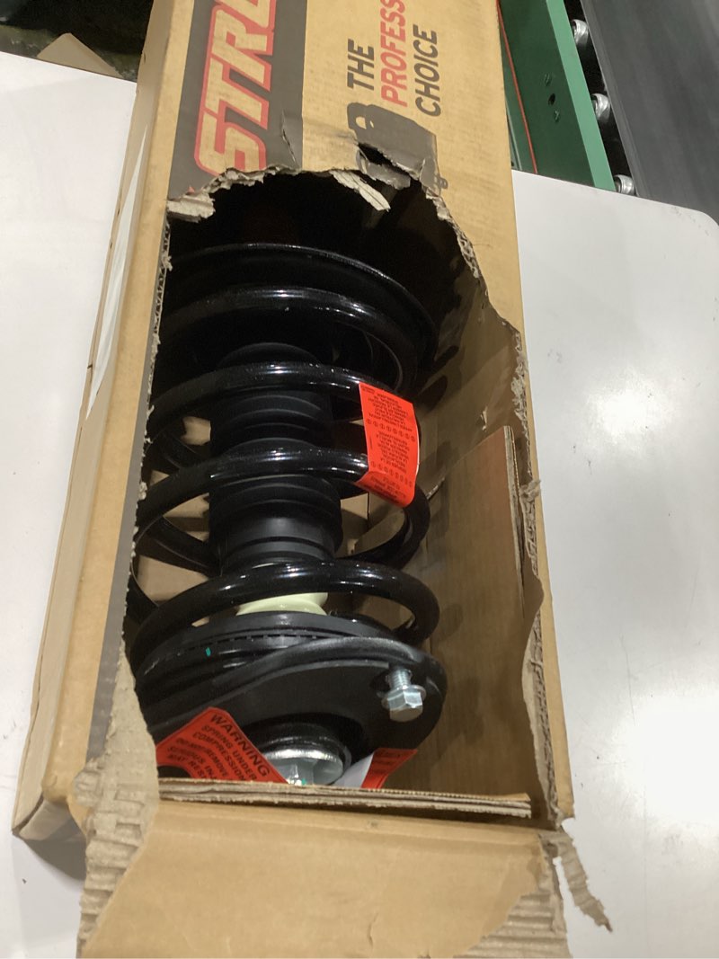 Condition photo showing As Is for monroe quick-strut 172780r suspension strut and coil spring assembly for dodge grand caravan, similar to stock photo