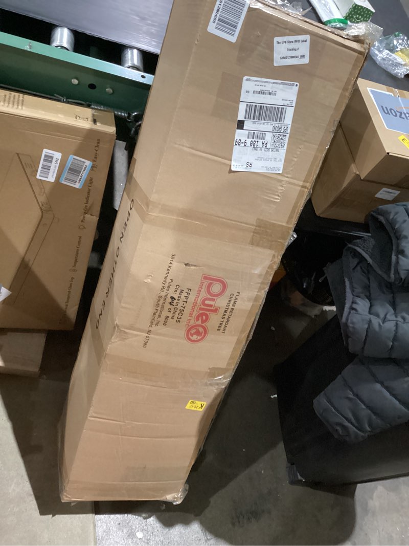 Condition photo showing As Is for Puleo International 7.5ft Pre-Lit Slim Fraser Fir Christmas Tree with 350 Clear Lights, 1188 Realistic Dense Branch Tips, Easy Setup Artificial Trees with Sturdy Metal Stand 7.5' Pencil Fraser Fir with 350 Clear Lights