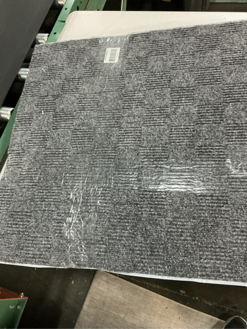 Condition photo showing As Is for Mohawk Home 24" x 24" Indoor/Outdoor 0.25" Pile Height, Peel and Stick Carpet Tile, Grey Polyester, (15 Tiles) (60 sqft/Box) Graphite Grey