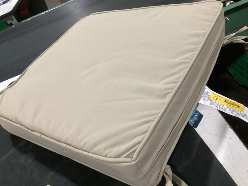 Condition photo showing As Is for origin 21 19.5-in x 20-in tan patio chair cushion