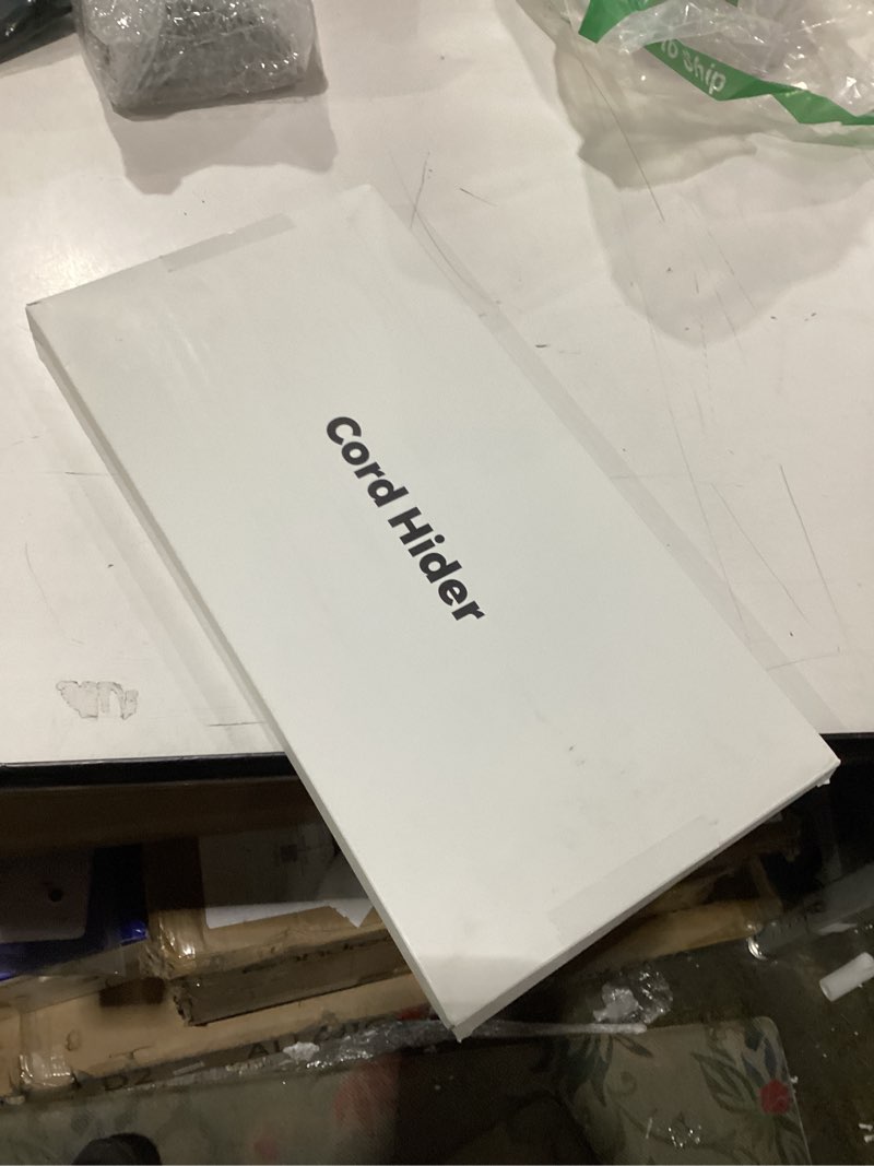 Condition photo showing New/Like New for Cord hider 