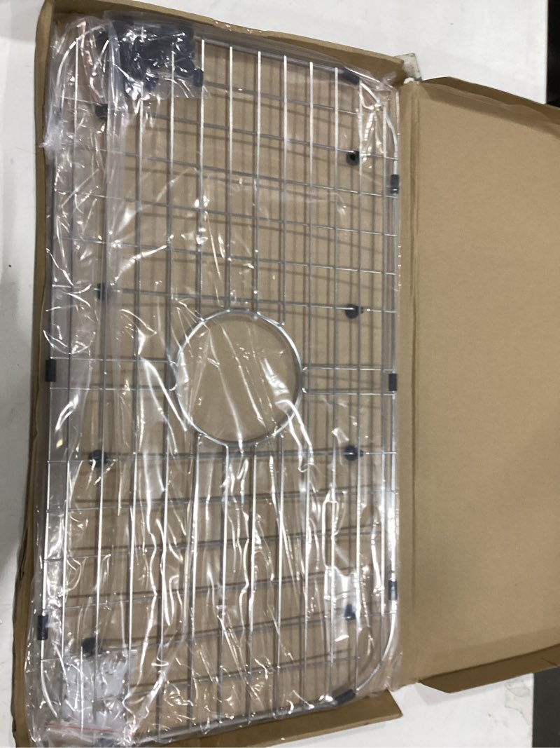 Condition photo showing As Is for serene valley sink protector grid 26-1/16" x 14-1/16", centered drain with corner radius 3-1/2", 304 stainless steel material nlw2614c