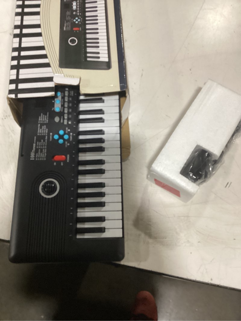 Condition photo showing As Is for 61 key keyboard piano,portable electronic digital piano,built in dual speakers,external microphone,power plug,rich teaching content,multi-functional electronic piano suitable for beginners black