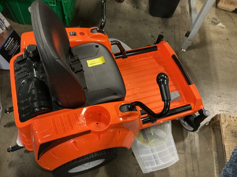 Condition photo showing As Is for kid trax zero turn lawn mower 12-volt ride-on