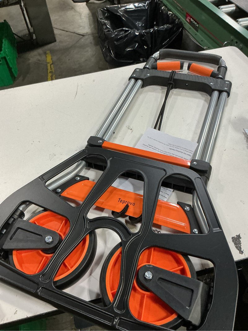Condition photo showing New/Like New for teprovo dolly cart, 309 lb aluminum folding hand truck with swivel handle, heavy duty utility dolly foldable trolley with elastic cord, 7 inch wheels for moving, warehousing, shopping and more
