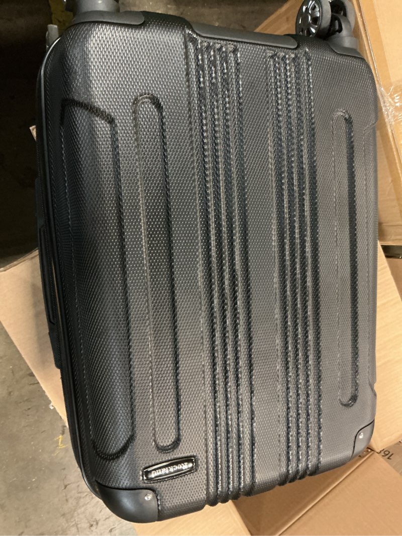 Condition photo showing As Is for rockland london hardside spinner wheel luggage, black, carry-on 20-inch black carry-on 20-inch