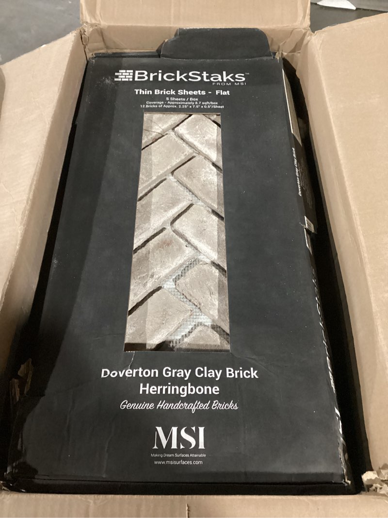 Condition photo showing Good Condition for MSI Doverton Gray 12.5 in. x 25.5 in. Clay Brick Herringbone Brick Floor, Wall Mesh-Mounted Mosaic Tile for Bathroom, Kitchen Backsplash, Accent Wall, Shower Doverton Gray Herringbone CASE
