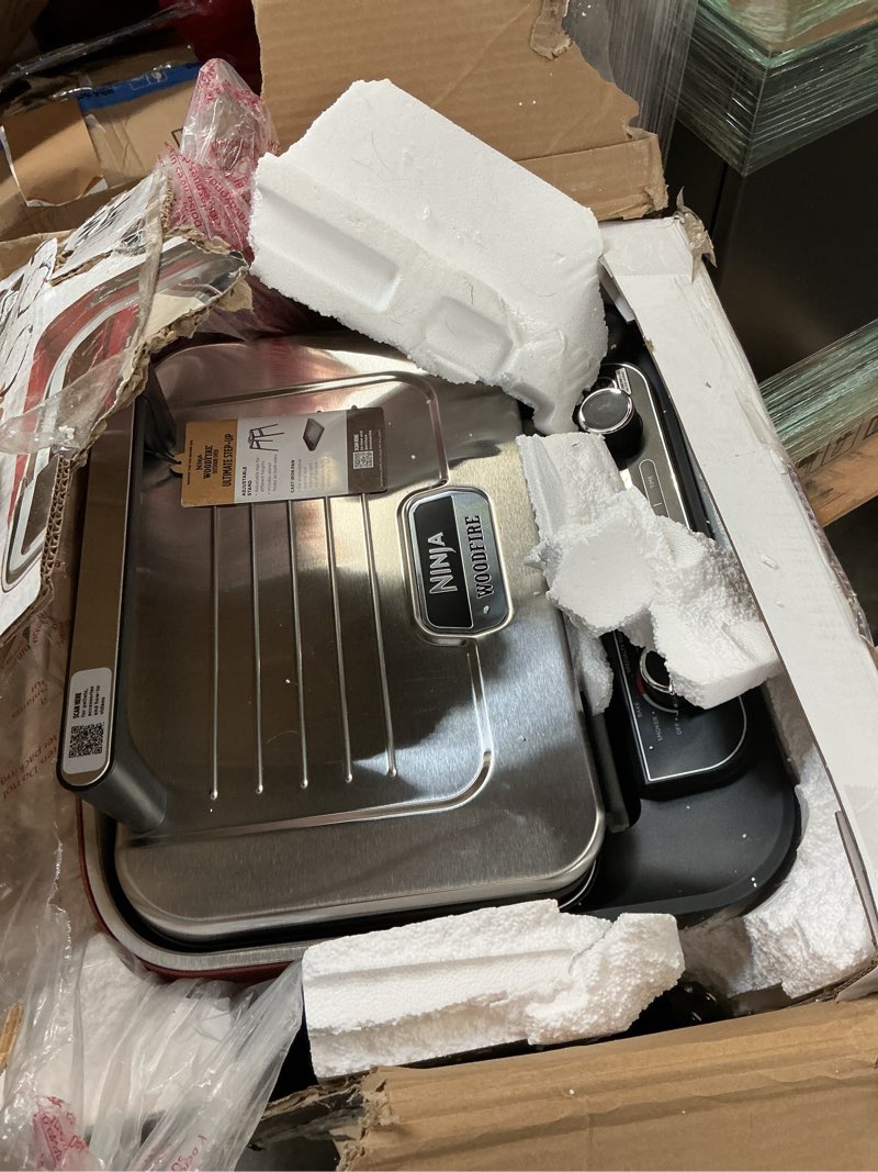 Condition photo showing As Is for Ninja Woodfire Outdoor Pizza Oven, 8-in-1 Portable Electric Roaster Oven, Heats up to 700°F, 5 Artisan Pizza Settings, Integrated BBQ Smoker Box, Includes Flavored Wood Pellets, Terracotta Red Pizza Oven + Smoker