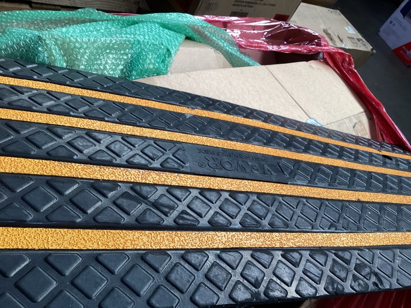 Condition photo showing As Is for vevor car driveway rubber curb ramp, 2 pack 48.8-inch-long heavy duty low profile slope ramps, 2.6’’ rise, 33069 lbs load capacity, reflective safety strips, for vehicles, rvs, and wheelchairs 48.8-inch-long (2 pack)