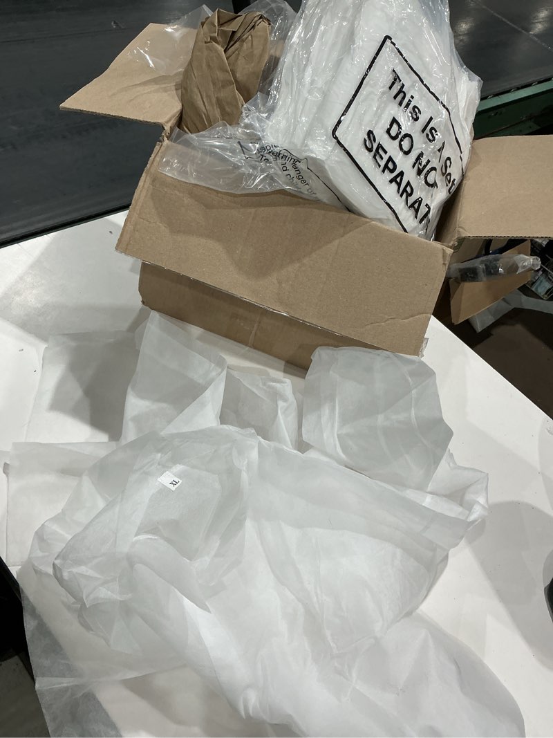 Condition photo showing Good Condition for keystone polypropylene white disposable frocks,wrist, no pockets, 30/case