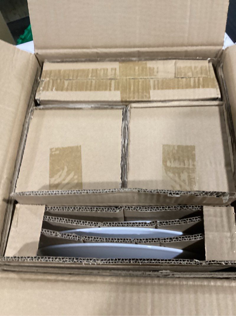 Condition photo showing New/Like New for amazon basics 16-piece porcelain kitchen dinnerware set with plates, bowls and mugs, service for 4 - white
