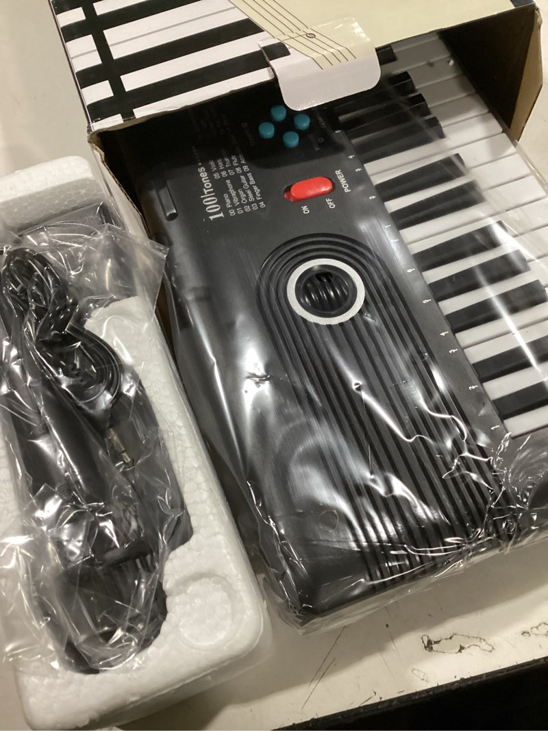 Condition photo showing New/Like New for 61 keys keyboard piano, Electronic Digital Piano with Built-In Speaker Microphone, Sheet Stand and Power Supply, Portable piano Keyboard Gift Teaching for Beginners Black