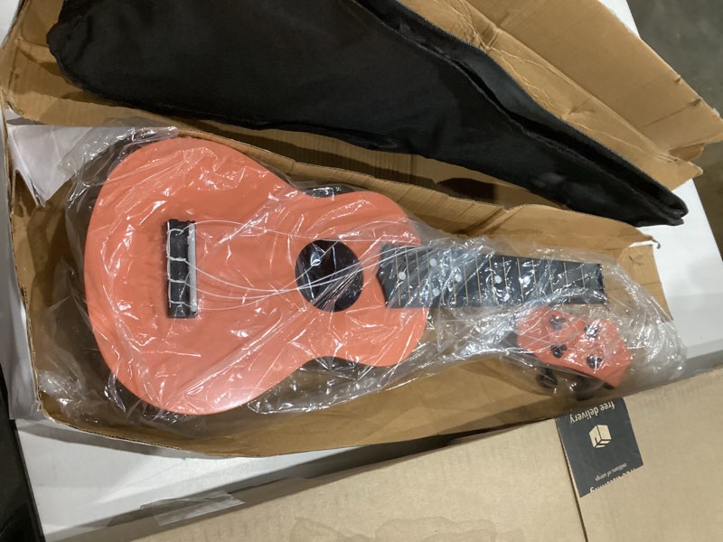 Condition photo showing As Is for BGMUSER Toy Ukulele 21 Inch Mini Kids Plastic Guitar Musical Instruments Educational Learning  Quantity  1  Toy for Children Toddler Beginner with Bag/Picks/Strap/Spare Strings (Orange)