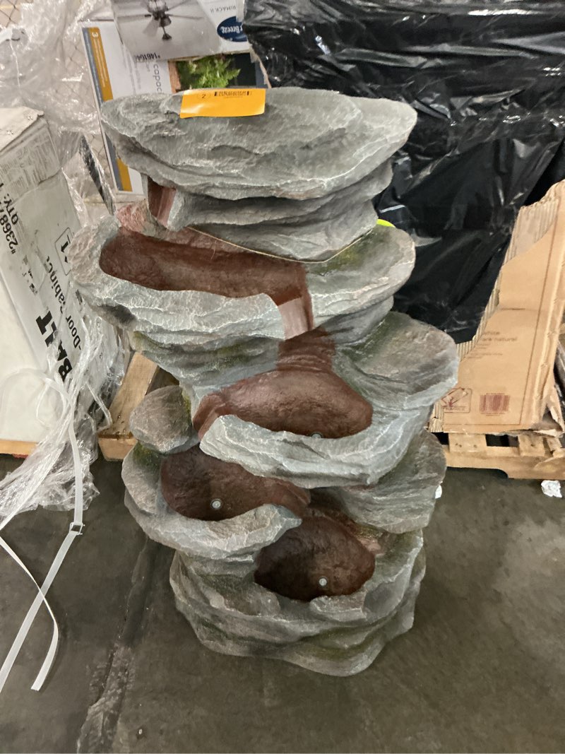 Condition photo showing As Is for 53 in. tall cascading stone water fountain with led lights
