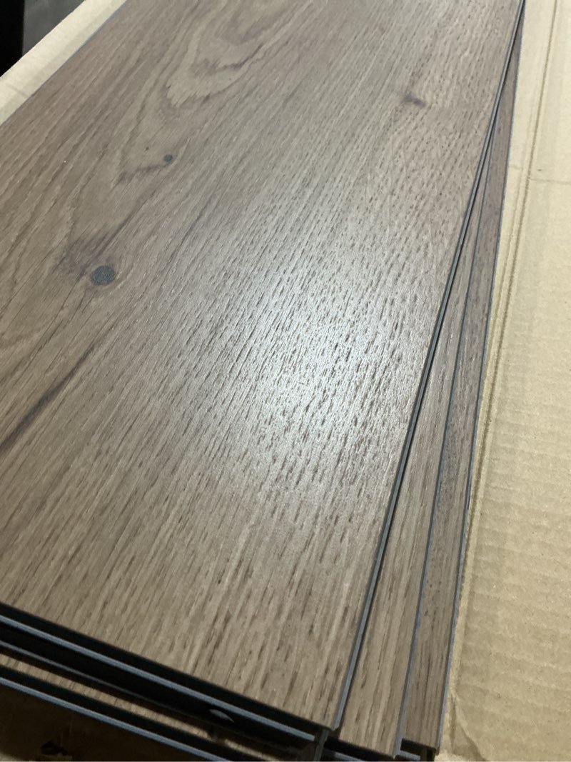 Condition photo showing As Is for pergo duracraft re rhone oak brown wood look 22-mil x 9-in w x 47-in l waterproof and water resistant interlocking luxury vinyl plank flooring ( 17.68-sq ft carton )