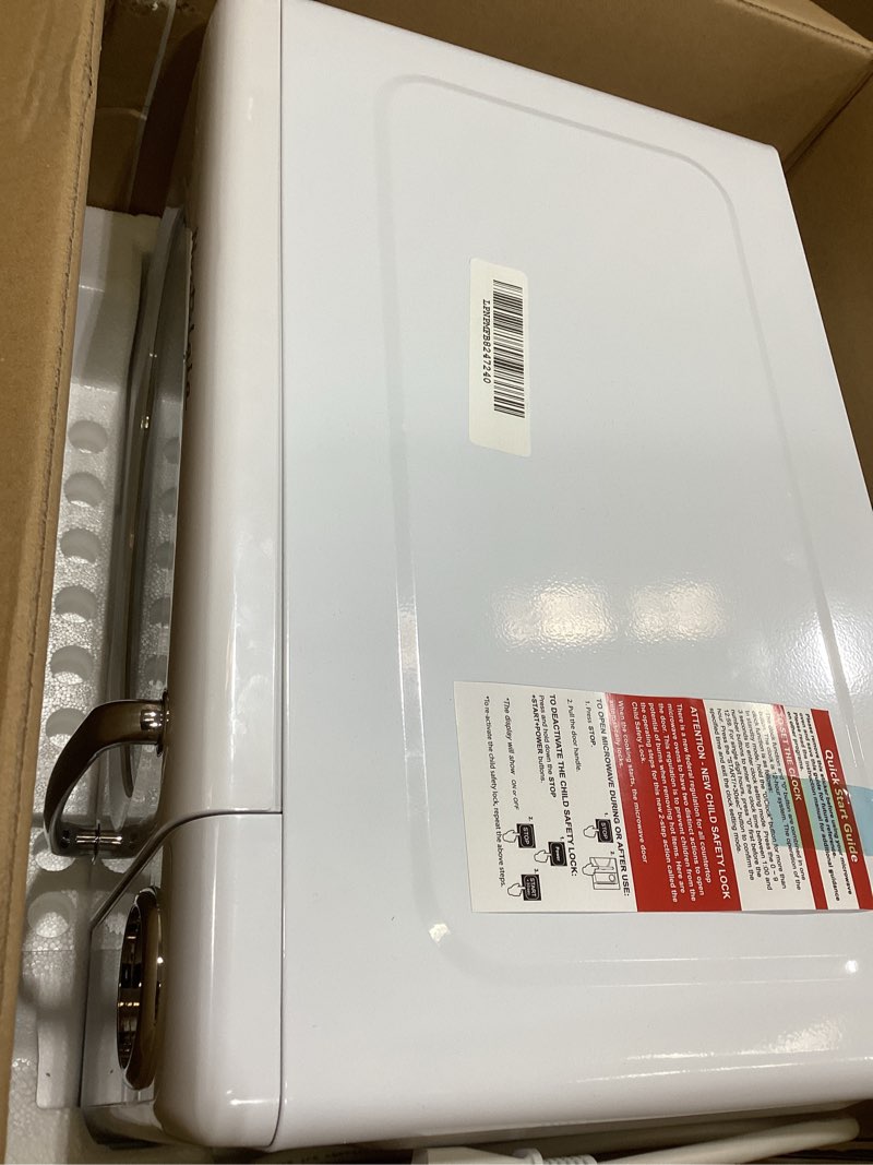 Condition photo showing New/Like New for Nostalgia Retro Microwave Oven - 0.7 Cu Ft, 700-Watt Countertop Size with Glass Turntable, Child Safety Lock, 8 Auto-Cook Programs, Digital Clock - White Retro 0.7 Cu. Ft. White