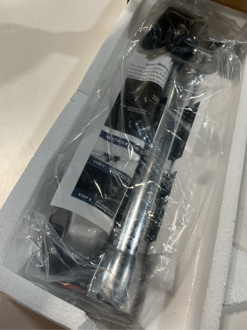 Condition photo showing New/Like New for anti-theft steering wheel & brake pedal lock with retractable double hook, 3 double row atom keys, car security lock for truck suv van, emergency window breaker, max length 33.5"