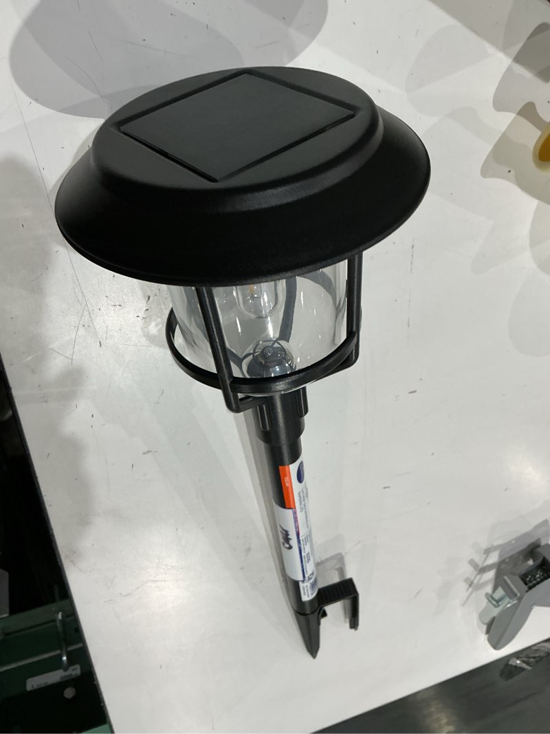 Condition photo showing As Is for harbor breeze path light 15 -lumens 0.2 -watt black solar led outdoor path light ( 3000-k )