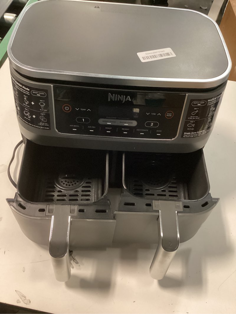 Condition photo showing As Is for Ninja DZ201 Foodi 8 Quart 6-in-1 DualZone 2-Basket Air Fryer with 2 Independent Frying Baskets, Match Cook & Smart Finish to Roast, Broil, Dehydrate & More for Quick, Easy Meals, Grey