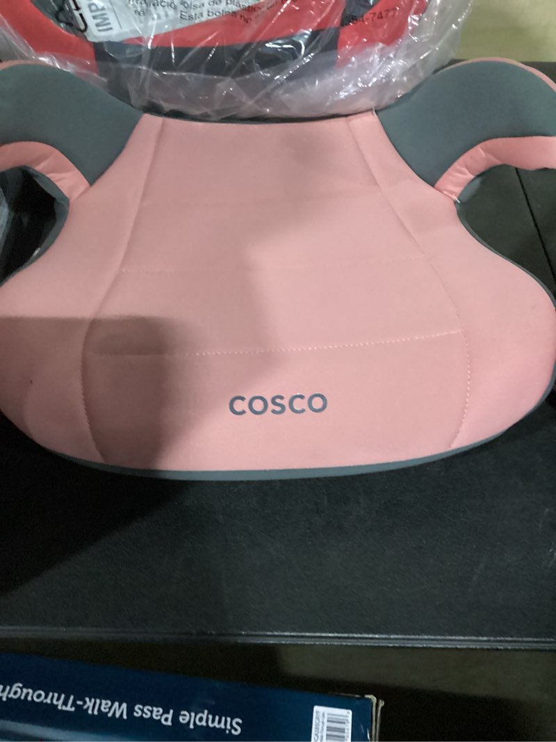 Condition photo showing As Is for ccosco kids pink booster car seat 