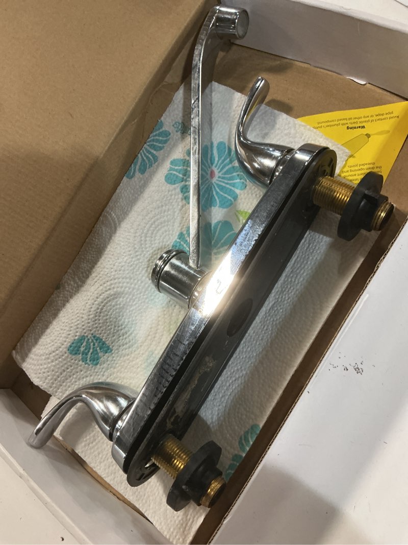 Condition photo showing As Is for project source dover chrome double handle kitchen faucet (deck plate included)