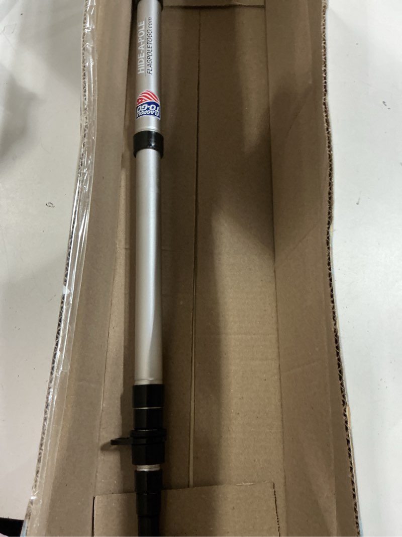 Condition photo showing As Is for hide a pole portable flagpole