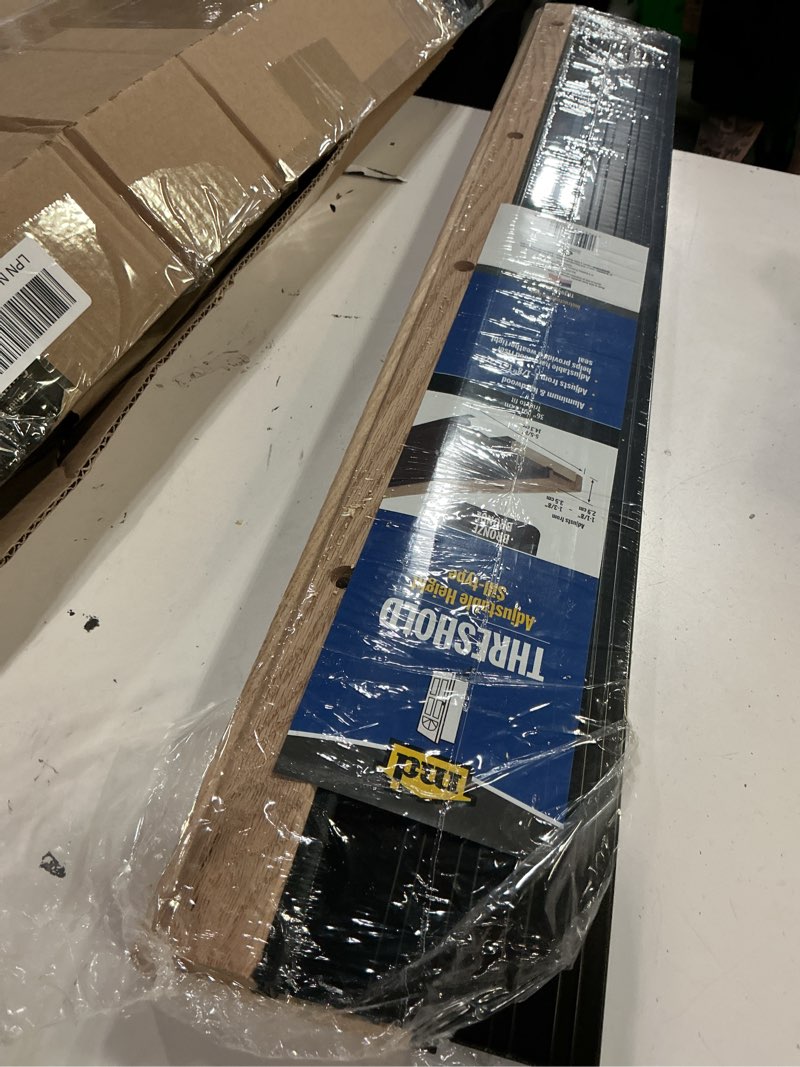 Condition photo showing Good Condition for m-d building products 78634 5-5/8 in. x 1-1/8 in. x 36 in. bronze adjustable aluminum & hardwood threshold kit - versatile solution for french and exterior doors bronze 5 5/8 in x 36 in