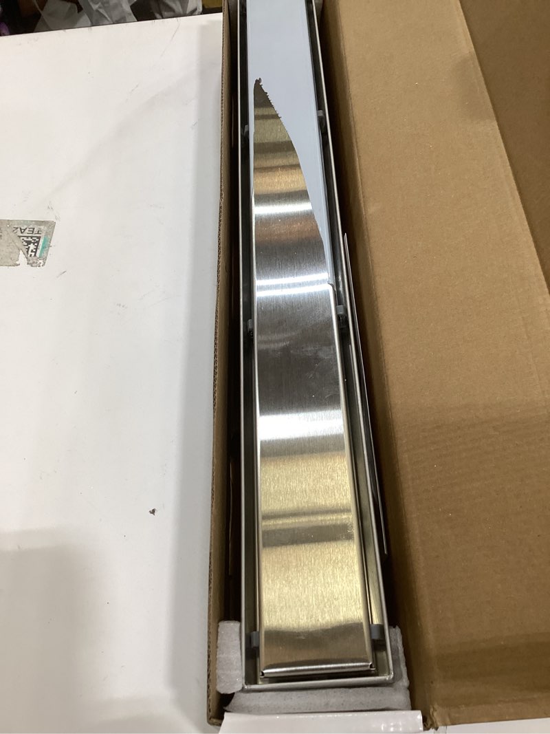 Condition photo showing Good Condition for SaniteModar Linear Shower Drain 24 inch with Tile Insert 2 in 1 Panels, 304 Stainless Steel Brushed Shower Linear Drain, Invisible Drain Equipped Adjustable Feet and Hair Filter Tile Insert Grate 24 INCH
