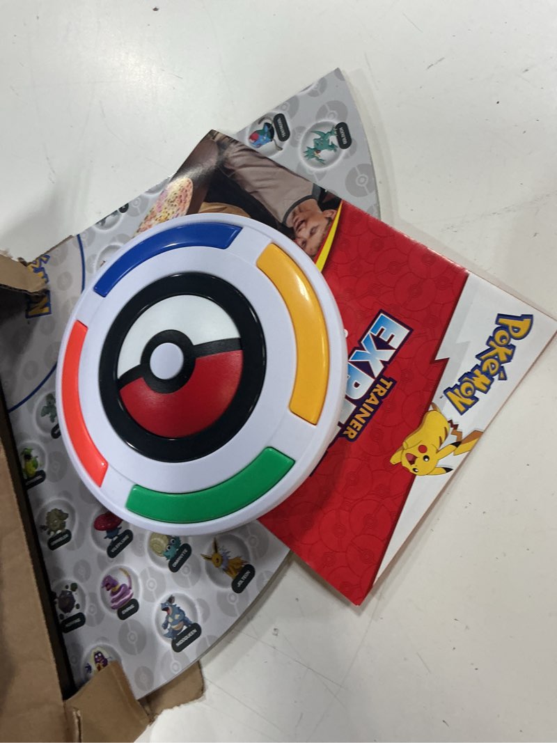 Condition photo showing As Is for pokemon trainer expert - electronic guessing board game, listen to the game master clues to identify 151 different pokemon, kids ages 6+, 1-4 players brown box packaging